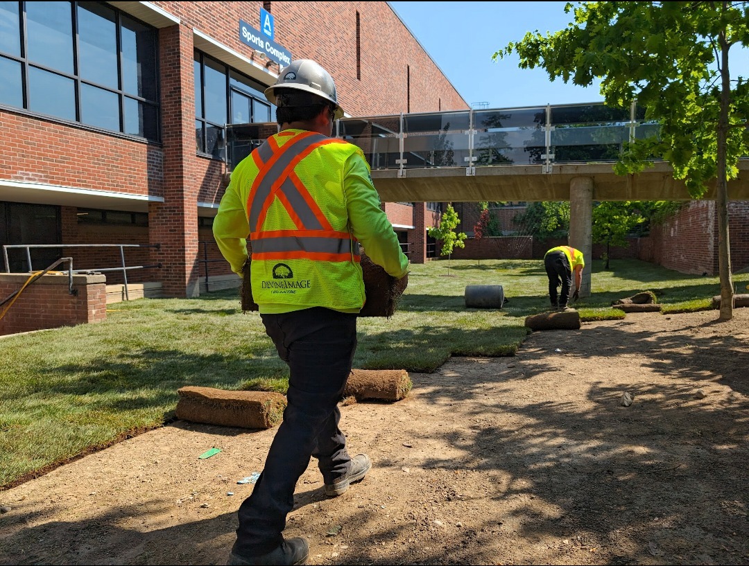 Devine Image branded crew member on commercial grading and drainage project